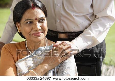 portrait of woman with hand on husband's hand, woman wearing sari and bindi View Large Photo Image Stock Photo - portrait of woman with hand on husband's hand, woman wearing sari and bindi. Fotosearch
