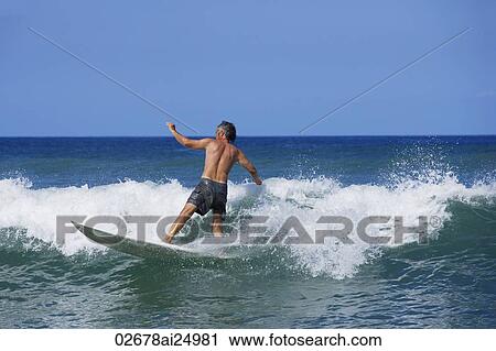 senior man surfing View Large Photo Image Stock Image - senior man surfing. Fotosearch