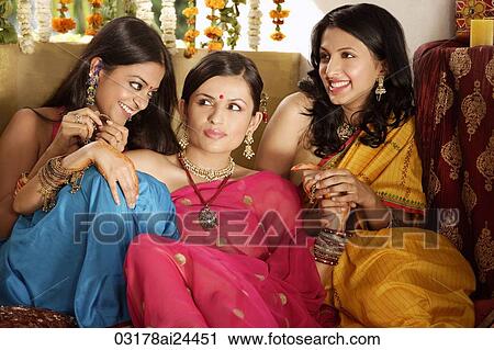 three young women wearing saris, one with bindi View Large Photo Image Stock Image - three young women wearing saris, one with bindi. Fotosearch