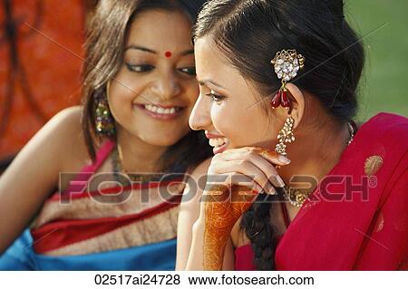 Stock Photo - two women in saris. Fotosearch