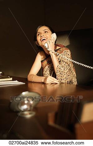 woman in sari on phone View Large Photo Image Stock Photography - woman in sari on phone. Fotosearch