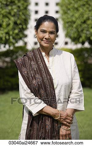 woman posing for outdoor portrait, wearing salwar kameez and shawl View Large Photo Image Stock Photo - woman posing for outdoor portrait, wearing salwar kameez and shawl. Fotosearch