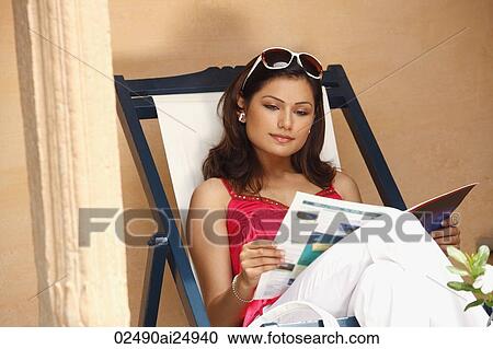Stock Image - woman reading. Fotosearch