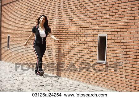 woman walking in exercise clothing View Large Photo Image Picture - woman walking in exercise clothing. Fotosearch