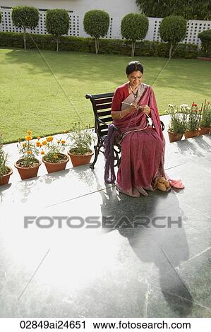 woman wearing a sari, knitting View Large Photo Image Stock Image - woman wearing a sari, knitting. Fotosearch