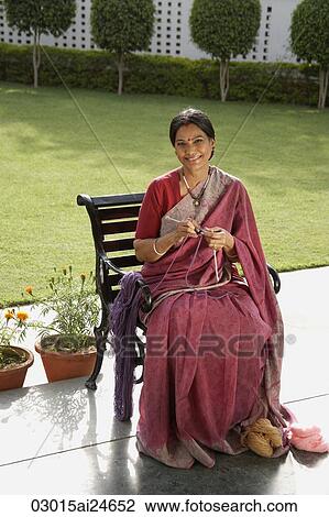 woman wearing a sari, knitting View Large Photo Image Stock Image - woman wearing a sari, knitting. Fotosearch