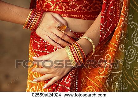 woman wearing sari, bangles View Large Photo Image Picture - woman wearing sari, bangles. Fotosearch