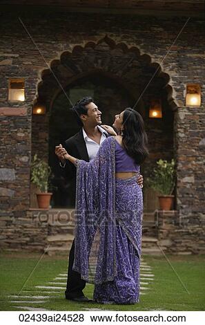 young couple dancing in garden, woman in sari View Large Photo Image Stock Photo - young couple dancing in garden, woman in sari. Fotosearch