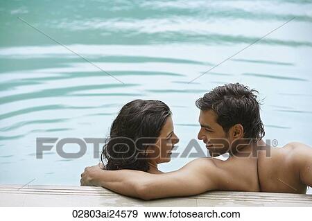 young couple in pool View Large Photo Image Stock Photo - young couple in pool. Fotosearch