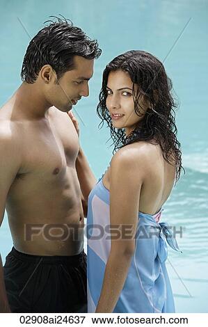 Stock Photo - young couple in pool. Fotosearch