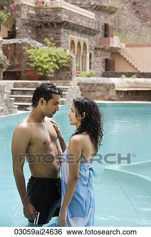 young couple in pool View Large Photo Image Stock Photograph - young couple in pool. Fotosearch