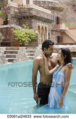 young couple in poolside View Large Photo Image Stock Image - young couple in poolside. Fotosearch