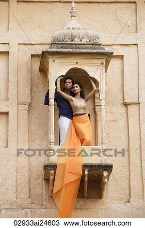young couple posing on balcony View Large Photo Image Stock Image - young couple posing on balcony. Fotosearch