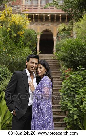 young couple smiling, embracing View Large Photo Image Stock Photograph - young couple smiling, embracing. Fotosearch
