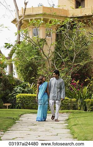 young couple strolling in garden View Large Photo Image Stock Image - young couple strolling in garden. Fotosearch