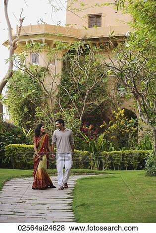 young couple strolling in garden, woman in sari View Large Photo Image Stock Photo - young couple strolling in garden, woman in sari. Fotosearch