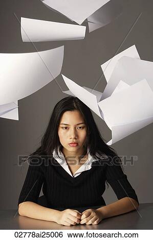 young lady sitting, paper falling View Large Photo Image Stock Photograph - young lady sitting, paper falling. Fotosearch