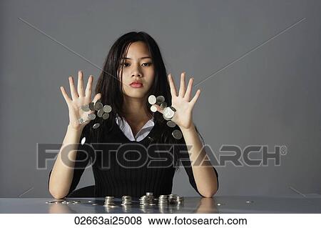 young lady throwing coins on table View Large Photo Image Stock Photo - young lady throwing coins on table. Fotosearch