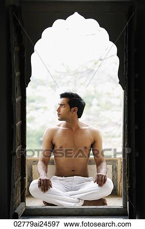 young man sitting cross legged, in doorway View Large Photo Image Stock Photo - young man sitting cross legged, in doorway. Fotosearch