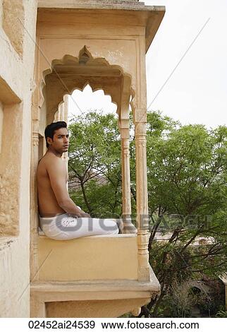 young man sitting on terrace balcony View Large Photo Image Stock Photo - young man sitting on terrace balcony. Fotosearch