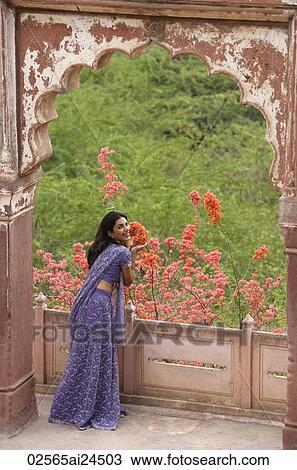 young woman at balcony, smiling View Large Photo Image Stock Image - young woman at balcony, smiling. Fotosearch