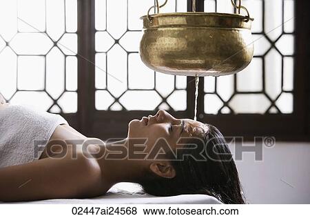 young woman having Ayurvedic spa treatment View Large Photo Image Stock Photo - young woman having Ayurvedic spa treatment. Fotosearch