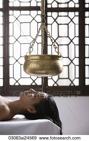 young woman having Ayurvedic spa treatment View Large Photo Image Stock Photo - young woman having Ayurvedic spa treatment. Fotosearch