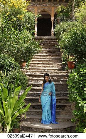 young woman in sari, posing in front of a flight of stairs View Large Photo Image Stock Image - young woman in sari, posing in front of a flight of stairs. Fotosearch