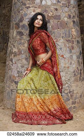 young woman in sari, stone pillar View Large Photo Image Stock Photo - young woman in sari, stone pillar. Fotosearch