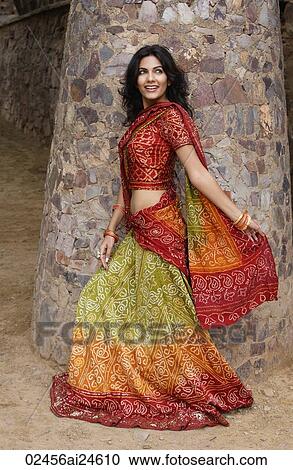young woman in sari walking, stone pillar View Large Photo Image Stock Image - young woman in sari walking, stone pillar. Fotosearch
