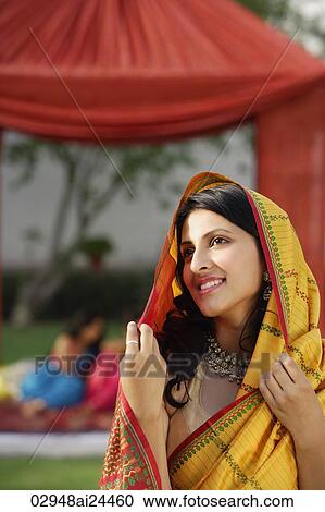 young woman in yellow sari View Large Photo Image Stock Image - young woman in yellow sari. Fotosearch