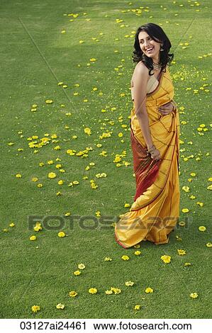 young woman in yellow sari View Large Photo Image Stock Image - young woman in yellow sari. Fotosearch