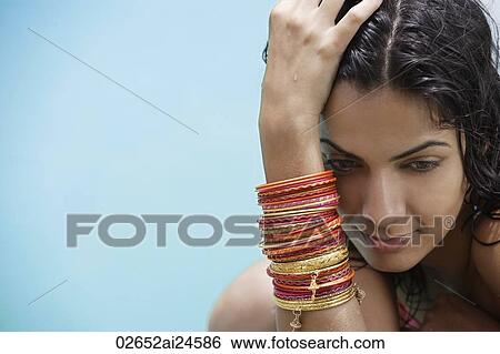 young woman wearing many bangles View Large Photo Image Stock Photograph - young woman wearing many bangles. Fotosearch