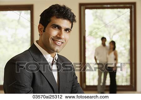 agent and couple in empty home View Large Photo Image Stock Image - agent and couple in empty home. Fotosearch
