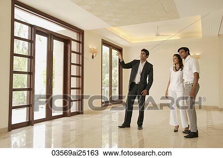 agent with young couple View Large Photo Image Stock Image - agent with young couple. Fotosearch