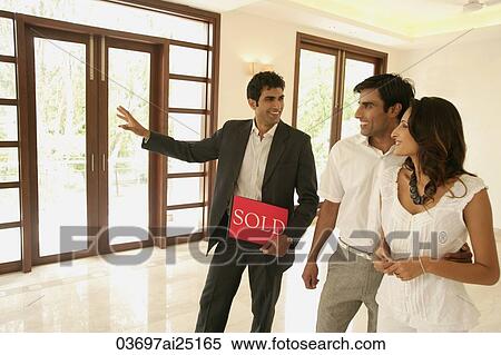 agent with young couple View Large Photo Image Stock Photography - agent with young couple. Fotosearch