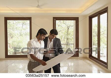 Stock Photo - architects with blueprints. Fotosearch