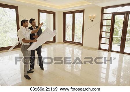 Stock Photo - architects with blueprints. Fotosearch
