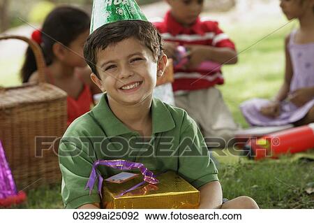 Stock Image - birthday boy with present. Fotosearch