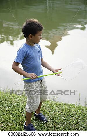 Boy with butterfly net View Large Photo Image Stock Photograph - Boy with butterfly net. Fotosearch