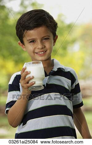 Picture - boy with glass of milk. Fotosearch