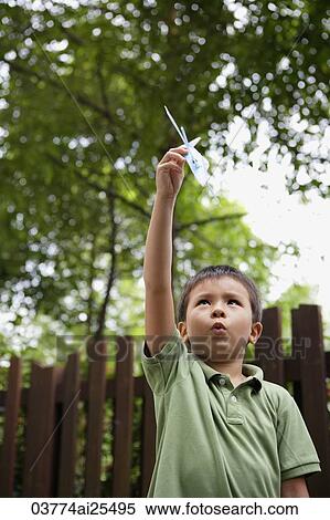 Stock Photography - Boy with toy airplane. Fotosearch