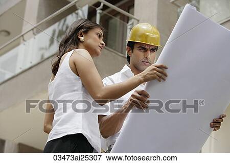contractor or architect with blueprints View Large Photo Image Stock Photo - contractor or architect with blueprints. Fotosearch