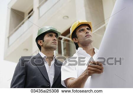 contractors or architects with blueprints View Large Photo Image Stock Photo - contractors or architects with blueprints. Fotosearch