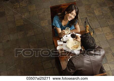 couple enjoying meal and drinks View Large Photo Image Stock Image - couple enjoying meal and drinks. Fotosearch