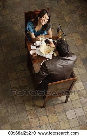couple enjoying meal and drinks View Large Photo Image Stock Image - couple enjoying meal and drinks. Fotosearch