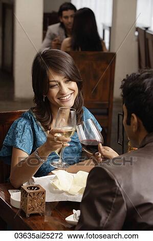 couple enjoying meal and drinks View Large Photo Image Stock Image - couple enjoying meal and drinks. Fotosearch