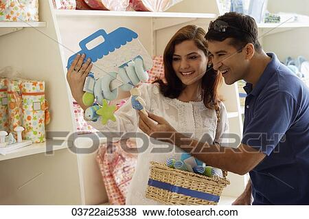 couple looking at baby items View Large Photo Image Stock Photo - couple looking at baby items. Fotosearch