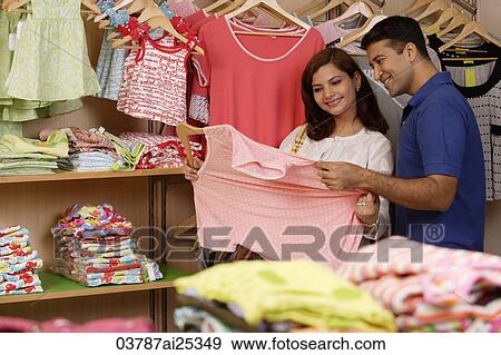 Couple shopping View Large Photo Image Stock Photo - Couple shopping. Fotosearch