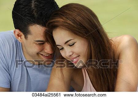 Couple sitting very close View Large Photo Image Stock Image - Couple sitting very close. Fotosearch